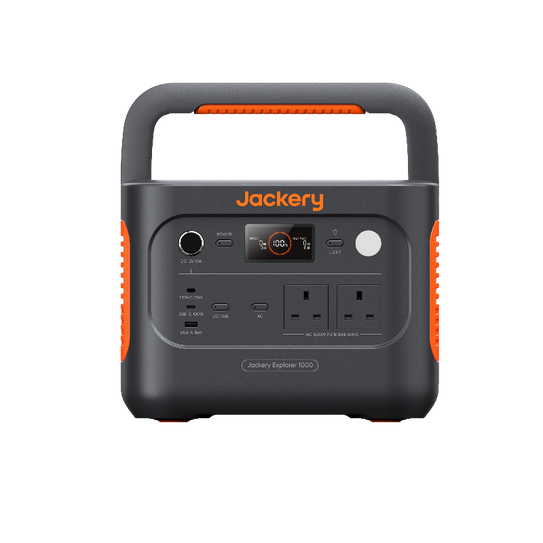 Jackery Explorer 1000 v2 Portable power station with Jackery branding, featuring multiple power outlets, a digital display, and carrying handles in a black and orange color scheme.