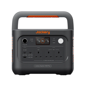 Jackery portable power station Explorer 1000 Plus v2 in dark gray with orange accents, featuring a built-in handle, digital display screen, multiple AC outlets, and various USB-C and USB-A ports, shown on a solid white background.