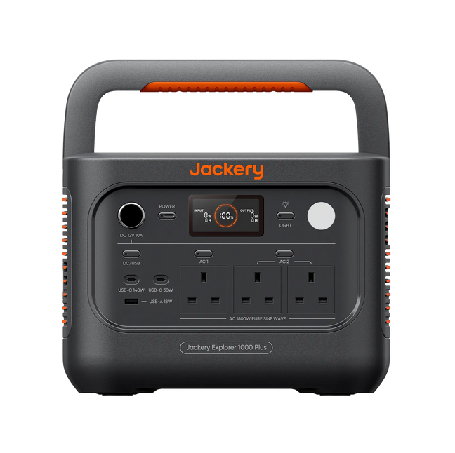 Jackery portable power station Explorer 1000 Plus v2 in dark gray with orange accents, featuring a built-in handle, digital display screen, multiple AC outlets, and various USB-C and USB-A ports, shown on a solid white background.