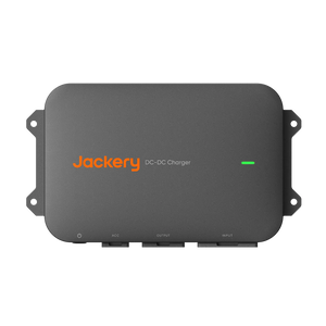 Jackery DC-DC Charger in dark gray with orange brand logo and a green power indicator light, shown on a plain white background.